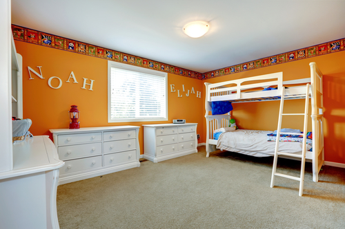 Bright orange boys room with bulk bed